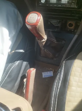 سردنده مدل SLX-SW مناسب برای پژو 405 به همراه گردگیر دنده و روکش ترمز دستی