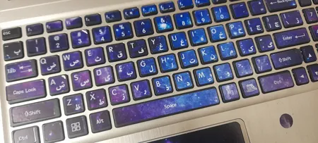 استیکر لپ تاپ راتیانا مدل space15 مناسب برای لپ تاپ 15 تا 17 اینچ به همراه برچسب حروف فارسی کیبورد