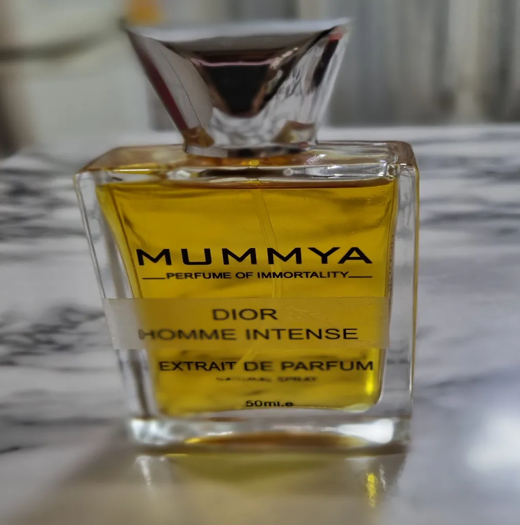 اکستریت پرفیوم مردانه مومیا مدل دیور هوم اینتنس با رایحه گرم حجم 50 میلی لیتر