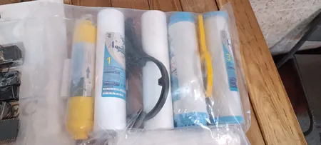 فیلتر دستگاه تصفیه کننده آب آکوا پیورست مدل AP-07 مجموعه 7 عددی به همراه کپسول فاضلاب مدل FLOW 300