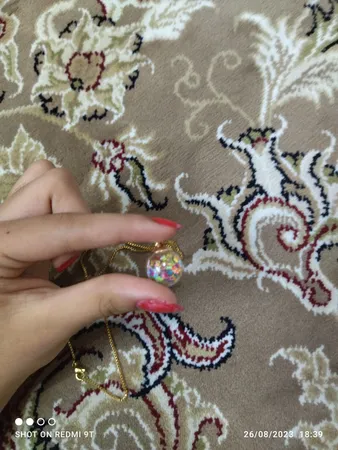 آویز گردنبند دخترانه مدل گوی شیشه ای پر ستاره کد AG 574