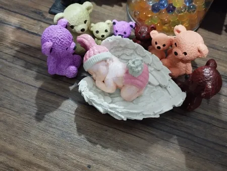 مجسمه سنگی مدل نوزاد روی بال فرشته