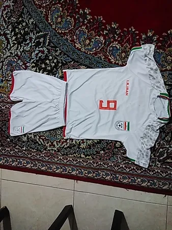 ست تی شرت آستین کوتاه و شلوارک ورزشی پسرانه طرح تیم ملی ایران مدل جام جهانی کد 2022