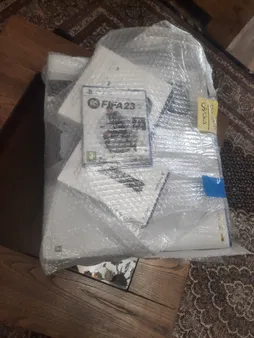کنسول بازی سونی مدل PlayStation 5 ظرفیت 825 گیگابایت ریجن 1200 آسیا به همراه دسته اضافی و پایه شارژر و بازی FIFA 23