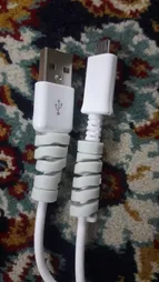 کابل شارژ USB به Micro USB مدل KL به طول به 2 متر به همراه دو عدد محافظ کابل سیلیکونی