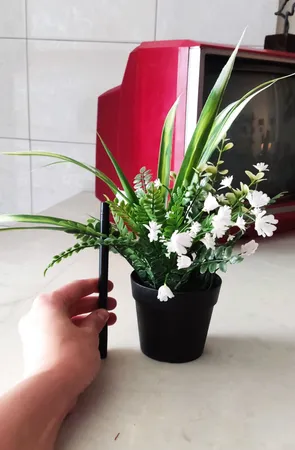 گلدان به همراه گل مصنوعی ایکیا مدل FEJKA کد 716.75