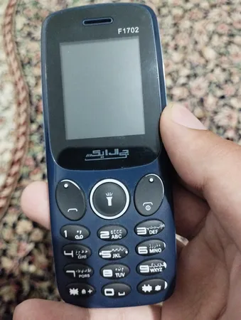 گوشی موبایل جی ال ایکس مدل f1702 دو سیم‌ کارت ظرفیت 32 مگابایت و رم 32 مگابایت