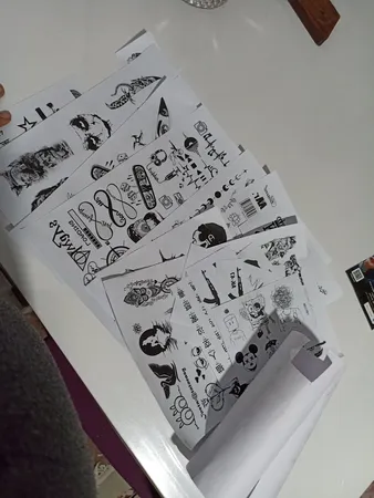 تتو موقت مدل خوشنویسی و فانتزی مجموعه 100 عددی به همراه اسپری تتو موقت