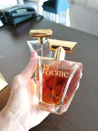 ادو پرفیوم زنانه لانکوم مدل Poeme حجم 100 میلی لیتر