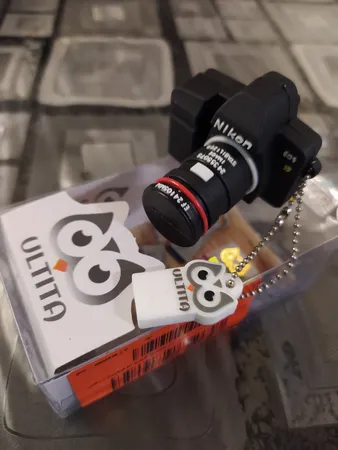 فلش مموری طرح دوربین عکاسی نیکون مدل Ul-CN02 ظرفیت 32 گیگابایت