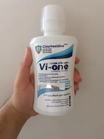 دهان شویه وی وان مدل Chlorhexidine حجم 330 میلی لیتر
