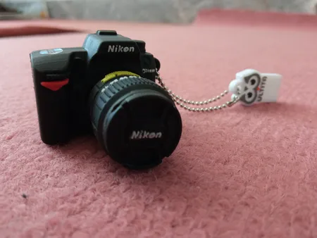 فلش مموری طرح دوربین عکاسی نیکون مدل Ultita -CN01 ظرفیت 32 گیگابایت