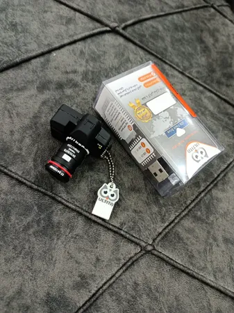 فلش مموری طرح دوربین عکاسی نیکون مدل Ul-CN02 ظرفیت 32 گیگابایت