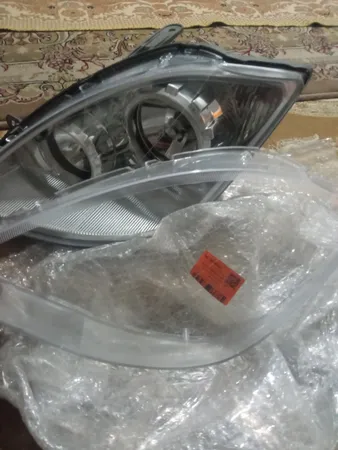 طلق چراغ جلو خودرو مدل فابریک مناسب برای تیبا بسته 2 عددی