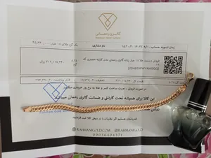 تجریه خرید دستبند طلا 18 عیار زنانه گالری رحمانی مدل کارتیه حصیری کد 019