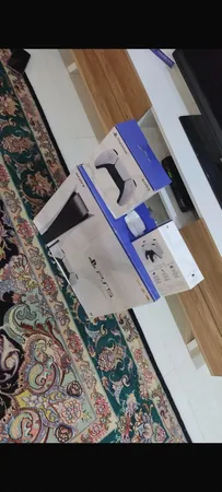 کنسول بازی سونی مدل PlayStation 5 ظرفیت 825 گیگابایت ریجن 1200 آسیا به همراه دسته اضافه و پایه شارژر