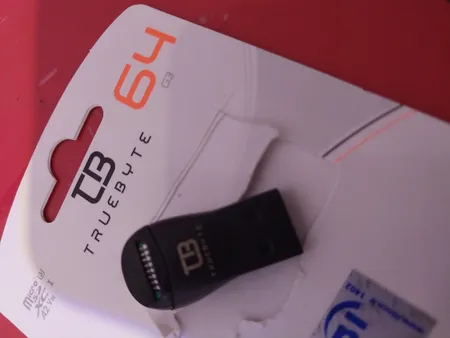 کارت حافظه microSD XC تروبایت مدل 633X-A2-V30 کلاس 10 استاندارد UHS-I U3 سرعت 95MBps ظرفیت 64 گیگابایت به همراه کارت‌خوان