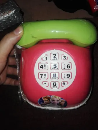 قلک طرح اسباب بازی تلفن و ماشین