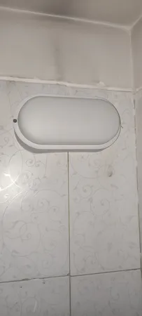 چراغ حمام دیواری پرتو درخشان مدل واترپروف IP65 طرح روکار بیضی