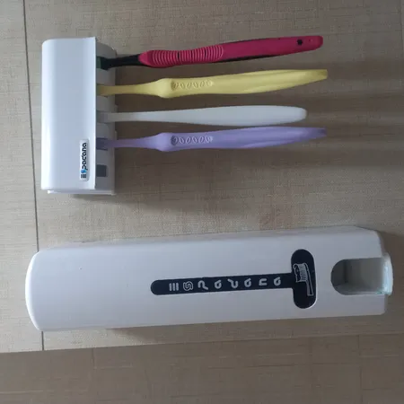 دستگاه خمیر دندان اتوماتیک اسپادانا به همراه جا مسواکی کد 99