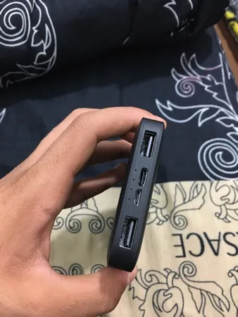 پاوربانک 10 وات شیائومی مدل Redmi ظرفیت 10000 میلی آمپر ساعت به همراه کابل تبدیل microUSB