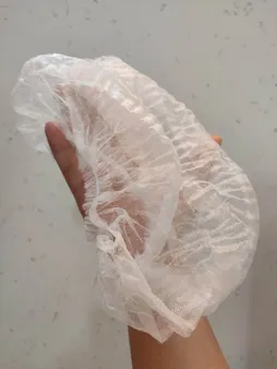 کلاه یکبار مصرف آکاردئونی مدل تی تی بسته 100 عددی