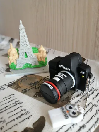 فلش مموری طرح دوربین عکاسی نیکون مدل Ul-CN02 ظرفیت 32 گیگابایت