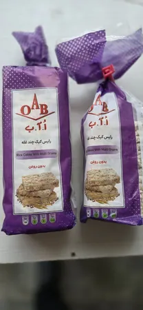 رایس کیک چند غله بدون روغن  اُ آ ب  - 100 گرم بسته 2 عددی