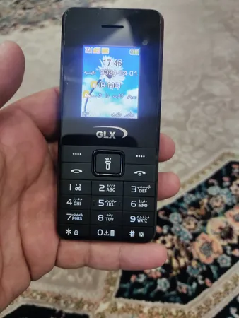 گوشی موبایل جی ال ایکس مدل iT5606 دو سیم کارت ظرفیت 32 مگابایت و رم 32 مگابایت