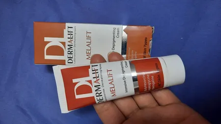 کرم روشن کننده صورت درمالیفت مدل Melalift مناسب انواع پوست حجم 40 میلی لیتر