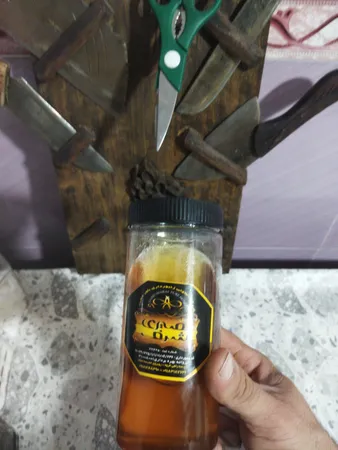 عسل ناب نصیری شرف - 1100 گرم