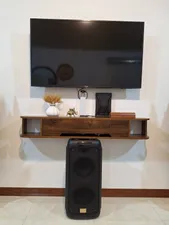 تجریه خرید میز تلویزیون دیواری مدل DLF84L