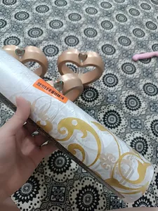 تجریه خرید سفره یکبار مصرف فیلجون مدل مجلسی طلا کوب رول 15 متری