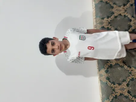 ست تی شرت آستین کوتاه و شلوارک ورزشی پسرانه طرح تیم ملی ایران مدل جام جهانی کد 2022