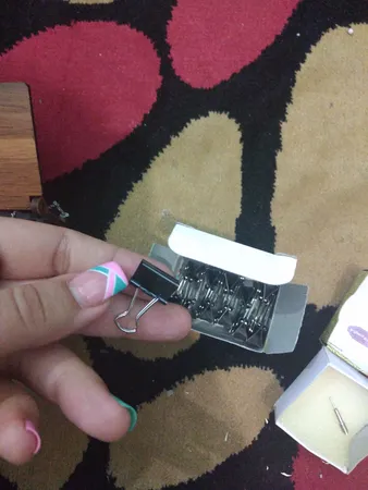 گیره کاغذ دینگ لی مدل DL.0006 سایز 15 میلی متر بسته 12 عددی