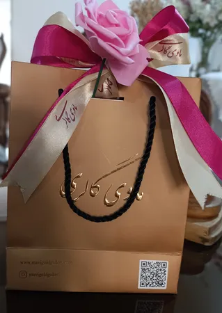 دستبند طلا 18 عیار زنانه ماوی گالری مدل ونکلیف تراشدار رز