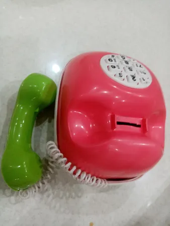 قلک طرح اسباب بازی تلفن و ماشین