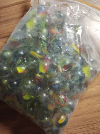 تیله شیشه ای مداد چوبی مدل چند پر بسته 100 عددی