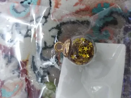 آویز گردنبند دخترانه مدل گوی شیشه ای پر ستاره کد AG 574