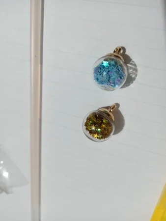 آویز گردنبند دخترانه مدل گوی شیشه ای پر ستاره کد AG 574