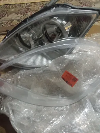 طلق چراغ جلو خودرو مدل فابریک مناسب برای تیبا بسته 2 عددی