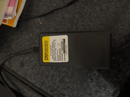 آداپتور 12 ولت 2 آمپر دی ای پی مدل dk1203_shenzhen