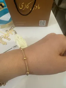 تجریه خرید دستبند طلا 18 عیار زنانه ماوی گالری مدل پاپ کورن و گوی