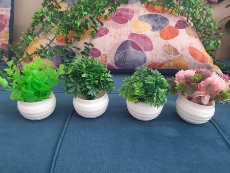 گلدان به همراه گل مصنوعی مدل سه گلی k16