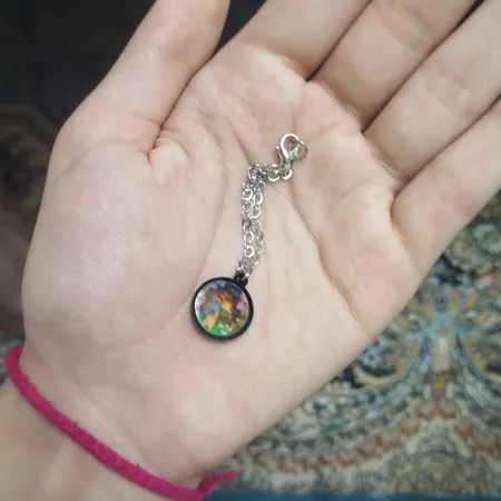 آویز ساعت زنانه ناکسیگو مدل شب تاب طرح ماینکرفت کد AW9049