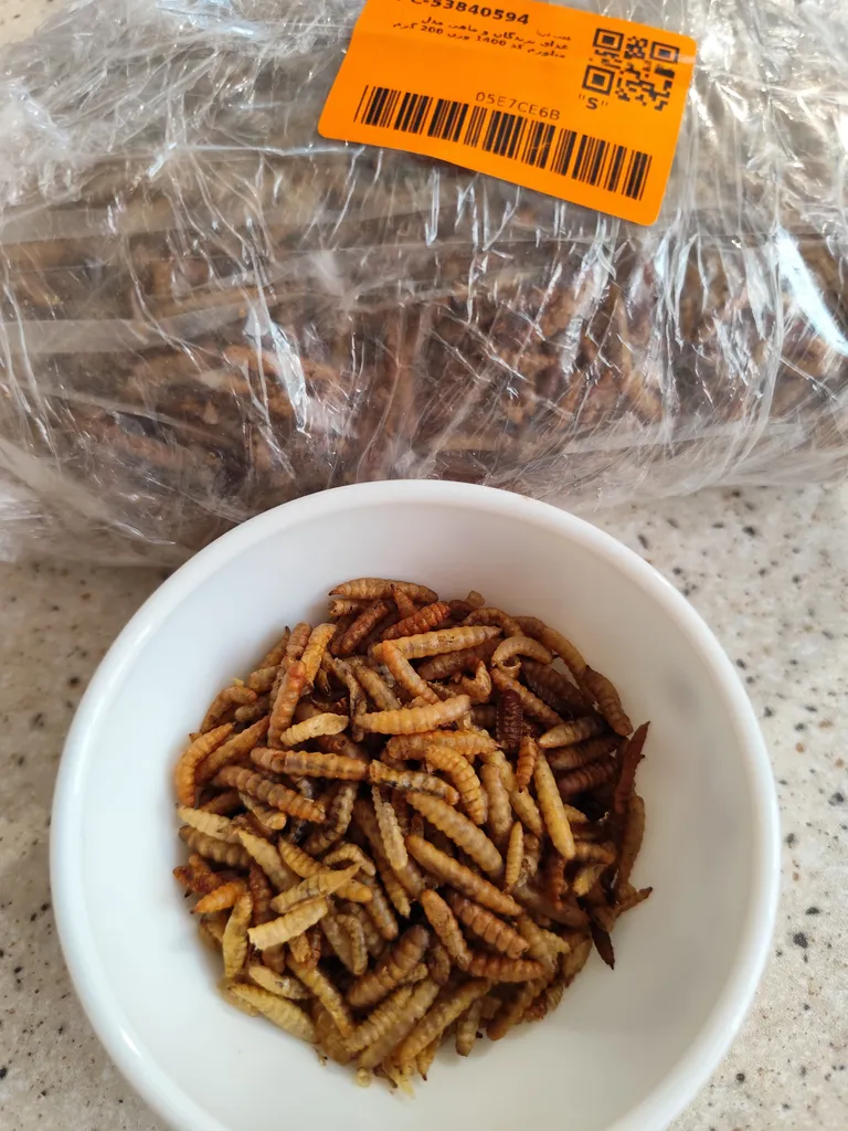 غذای پرندگان و ماهی مدل میلورم کد 1400 وزن 200 گرم