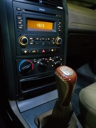 سردنده مدل SLX-SW مناسب برای پژو 405 به همراه گردگیر دنده و روکش ترمز دستی