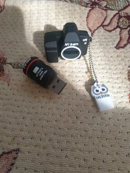 فلش مموری طرح دوربین عکاسی نیکون مدل Ul-CN02 ظرفیت 32 گیگابایت