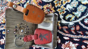 تجریه خرید کاور ریموت خودرو چرم آراهمراه کد ARAJ601 مناسب برای پژو 206