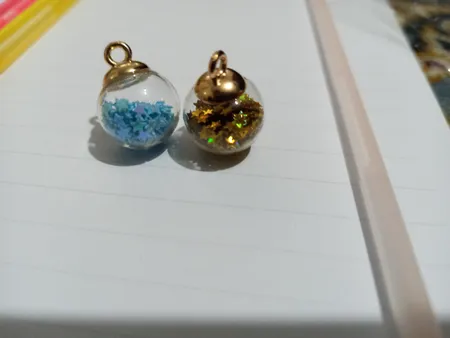 آویز گردنبند دخترانه مدل گوی شیشه ای پر ستاره کد AG 574